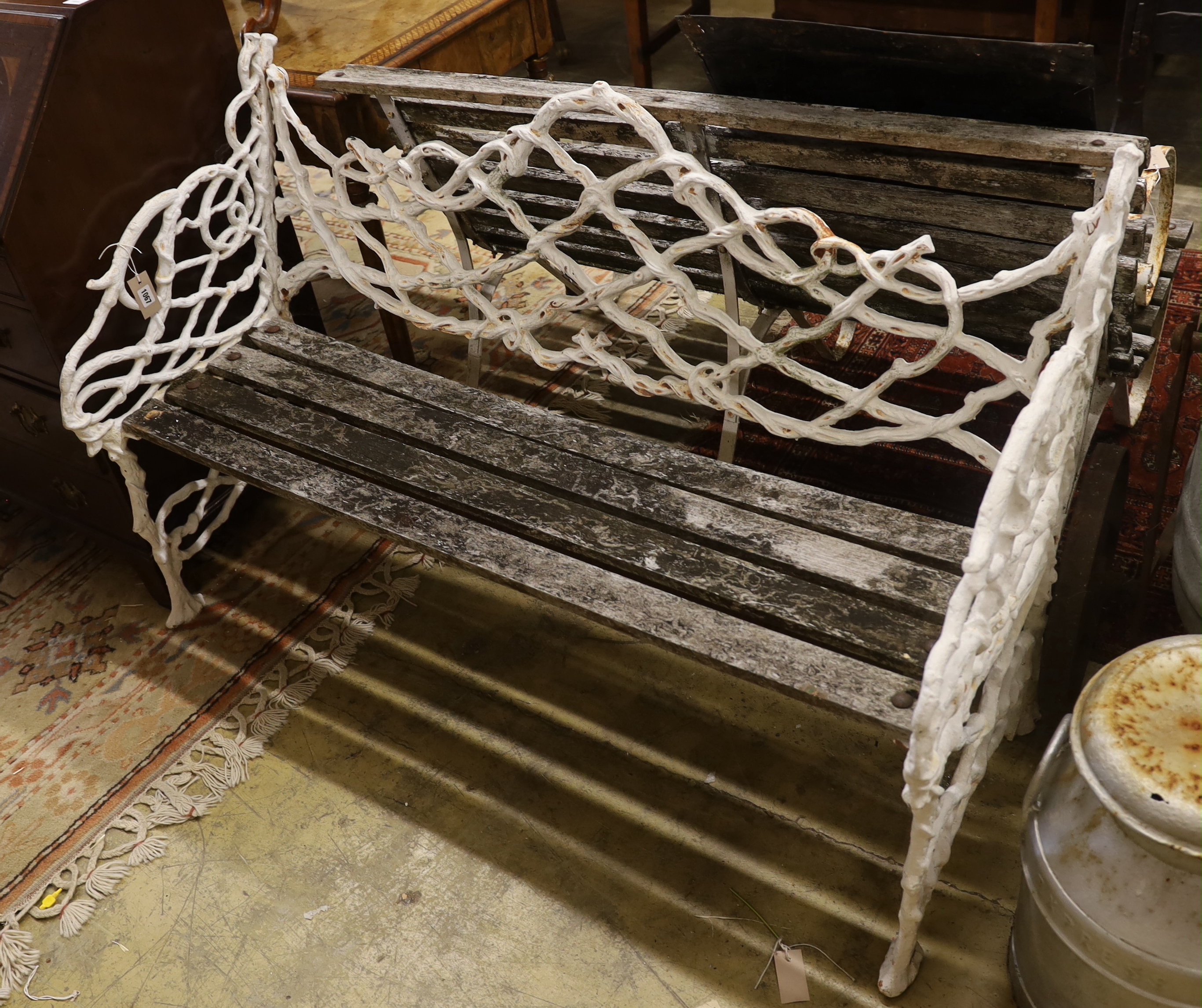 A Victorian Coalbrookdale design painted cast iron garden bench, length 138cm, depth 55cm, height 86cm